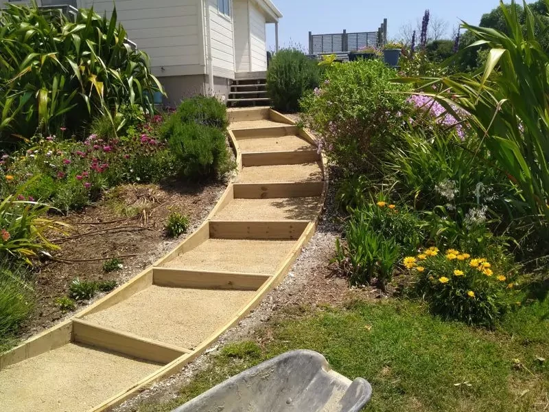 Wellington landscape transformation showing retaining walls and custom decking that increase property value